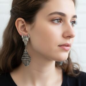 Holy Cow Earrings handcrafted in 92.5 sterling silver, 20gm weight with spiral drop design, displayed on black stand.