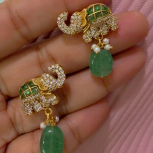 Buy beautiful royal elephant design green stone dangler earrings from Ahsaas Jewellery. Perfect for weddings, parties and festive occasions. Stylish, elegant and affordable jewellery for women.